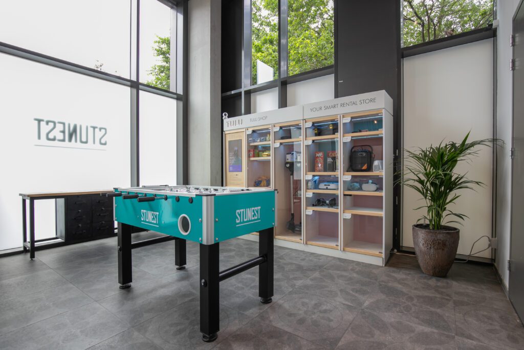 Laundry areas with TULU vending machine and table football table